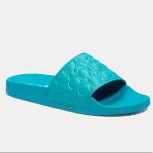 Brand new never been worn teal coach slides